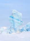 Iceberg in the frozen Mohnbukta in Sabine-Land. Spitzbergen in the Svalbard. Scandinavia, Norway. Art Print